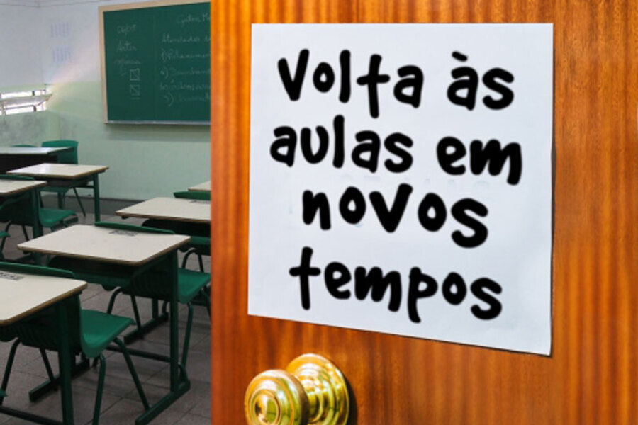 Foto de um cartaz preso na porta da sala de aula escrito "Volta às aulas em novos tempos"